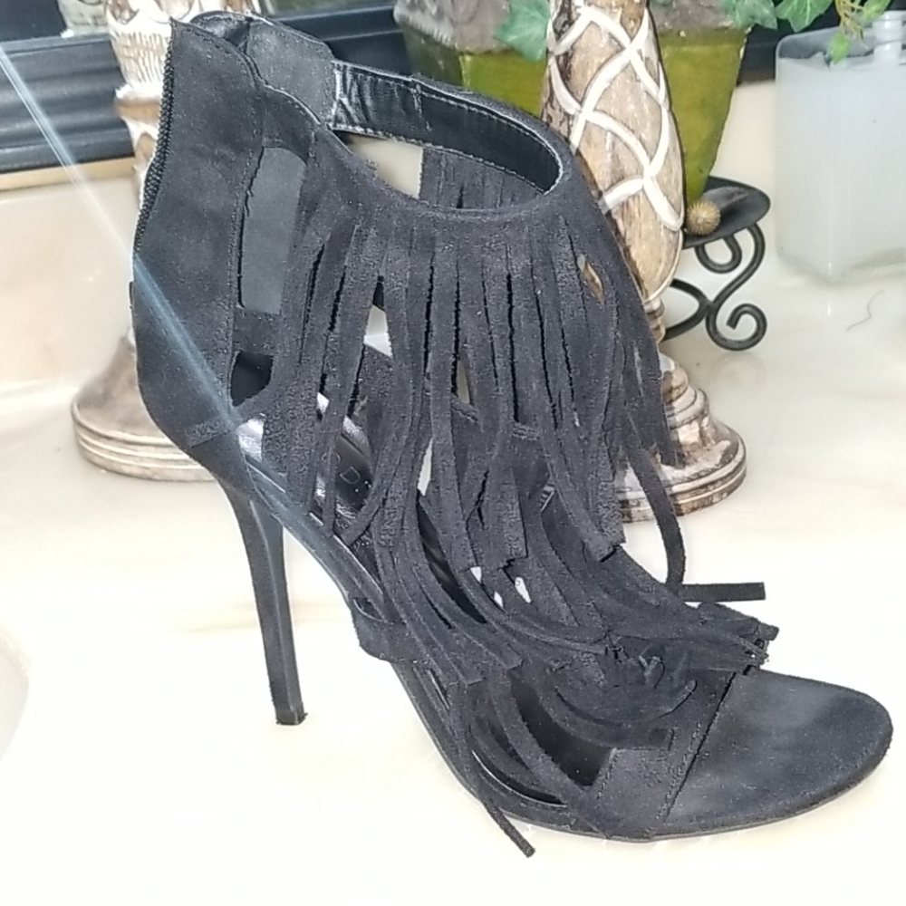 Black suede fringe sandle heels.